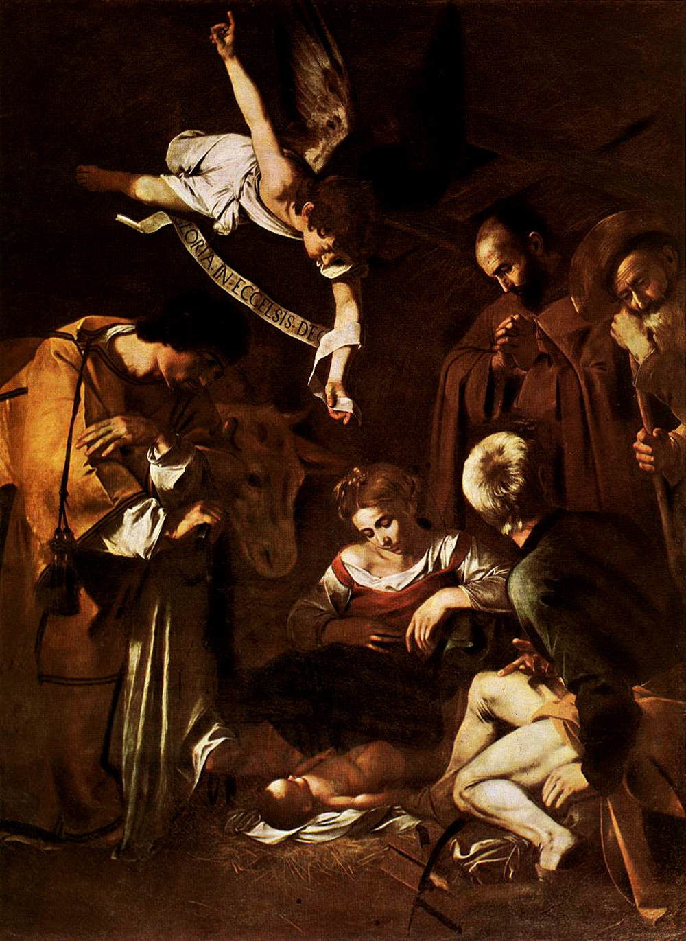 michelangelo_caravaggio_77_nativity_with_st_francis_and_st_lawrence